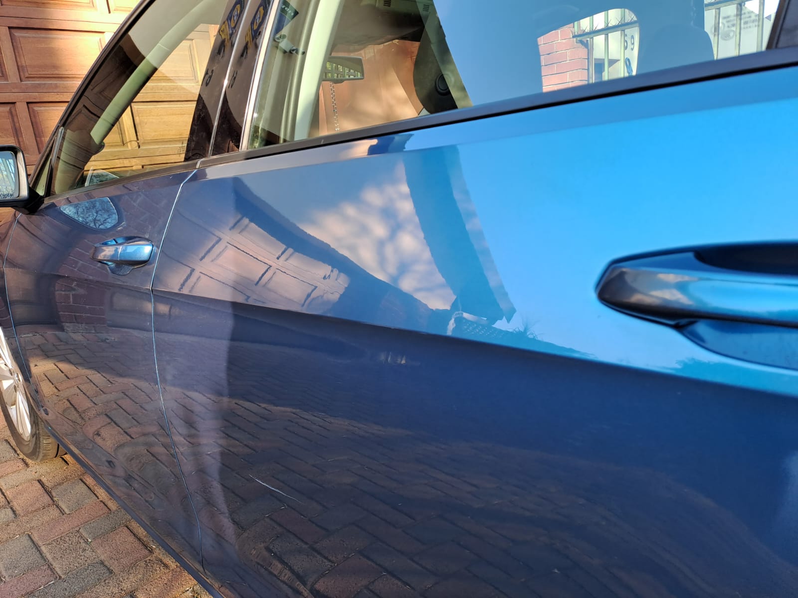 polo after No visible dent left with the crease line restored back to its original state