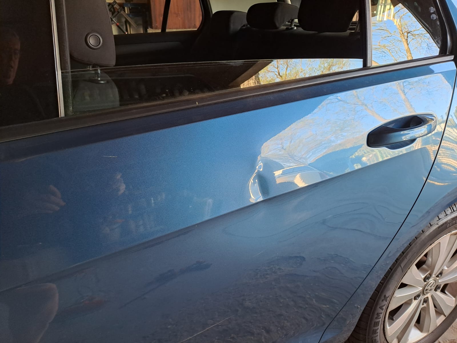 polo before Dent on the bodyline of the rear door pannel